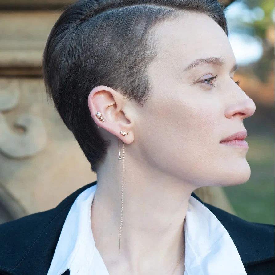 Portrait shot featuring the 14k gold chain threader earring.