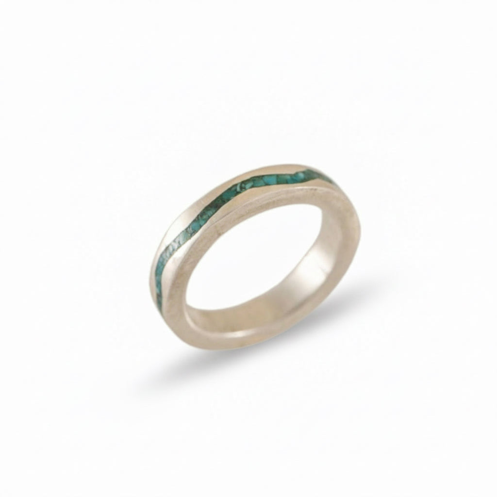 Side profile view of the Rio Grande sterling silver ring showing crushed turquoise inlay.