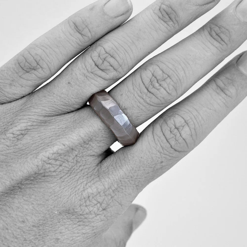 Shaya Durbin's Ridgeline Band worn on a hand, showing the textured sterling silver ring, faceted contours and minimalist statement design.