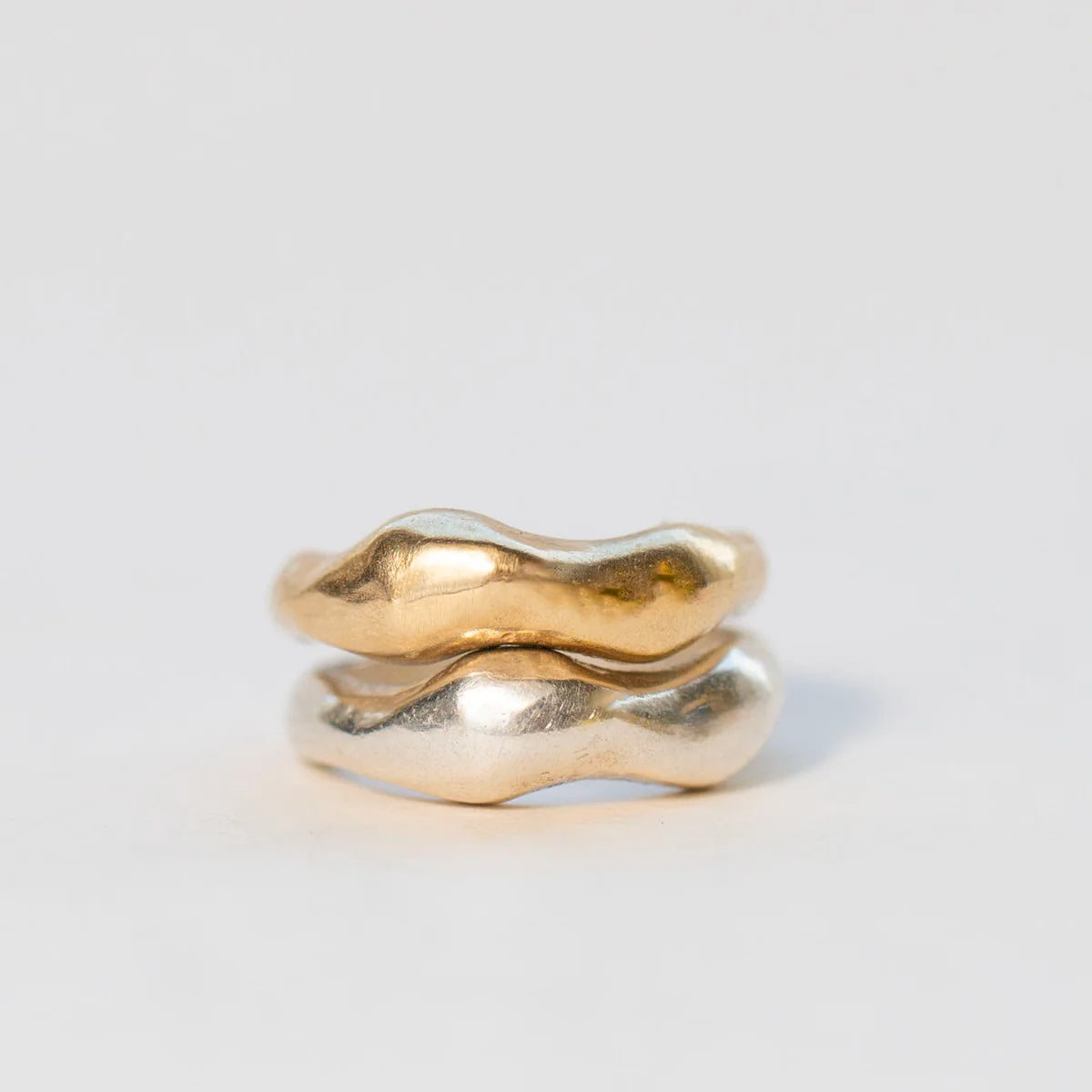 Stacked Tides Rings in sterling silver and 14k gold vermeil.
