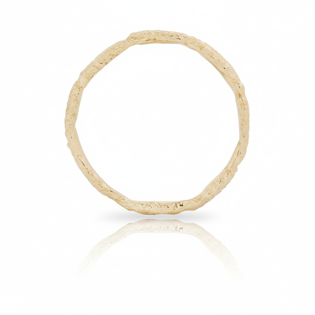 Back view of the handcrafted 14k yellow gold Wheat Ring, showing its slender band, delicate wheat-inspired details, and organic sculptural texture.