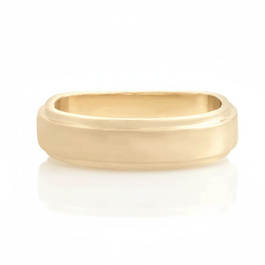 Polished 14k yellow gold comfort fit wedding band with a smooth, wide profile.