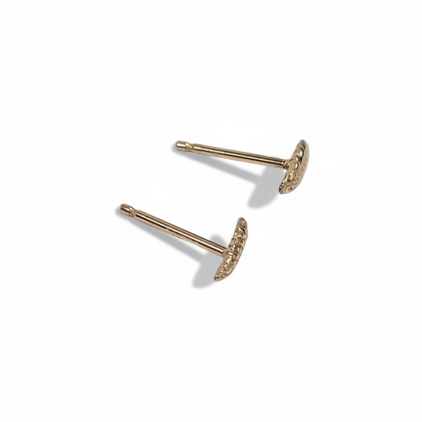 Reverse angled view of the Gluten Free Stud Earrings in 14k yellow gold, highlighting the handcrafted wheat motifs and straight posts.