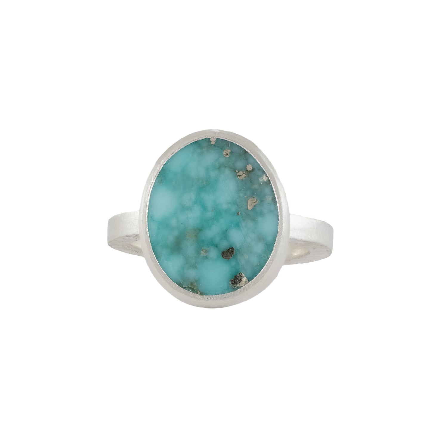 Turquoise ring with silver band on a white background