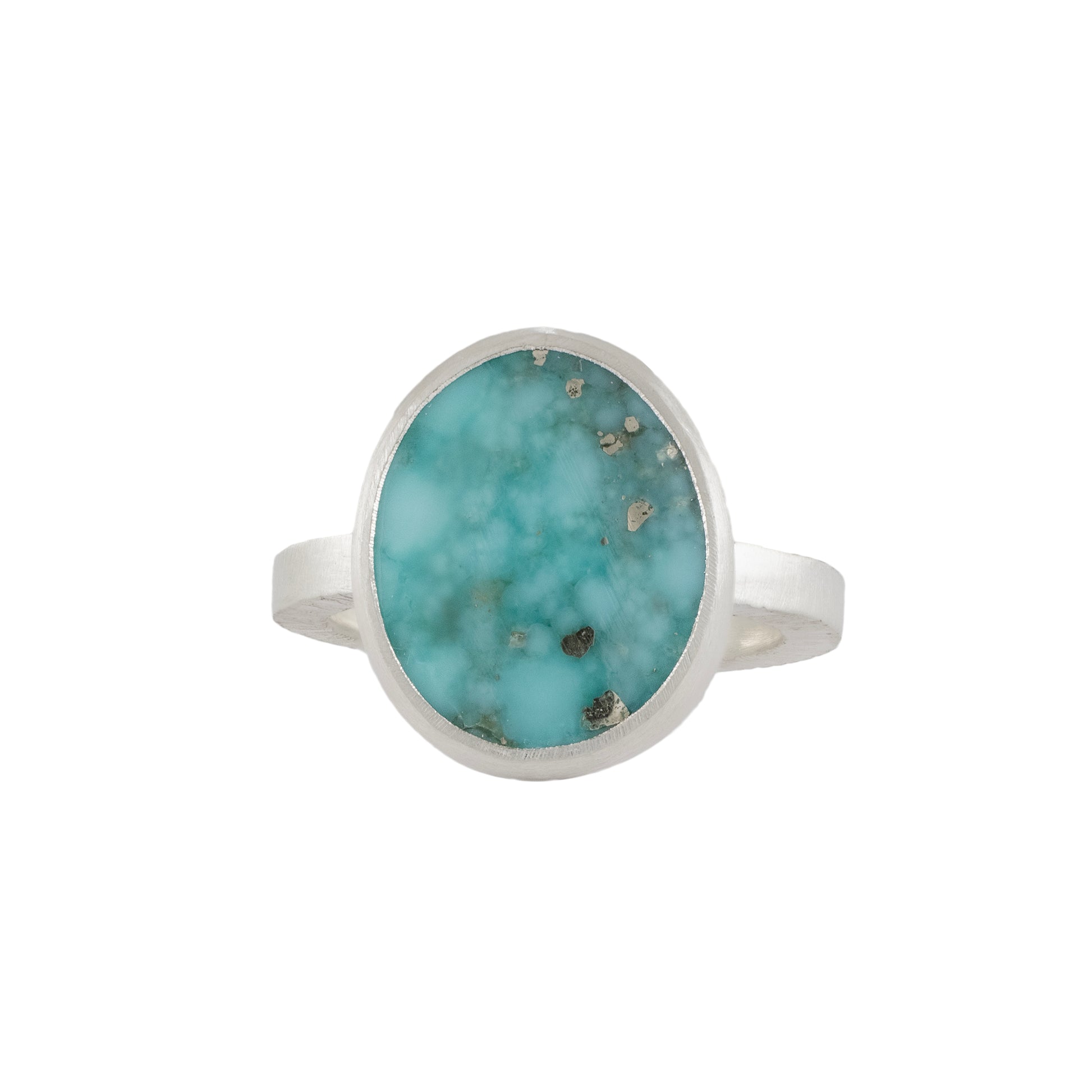 Turquoise ring with silver band on a white background