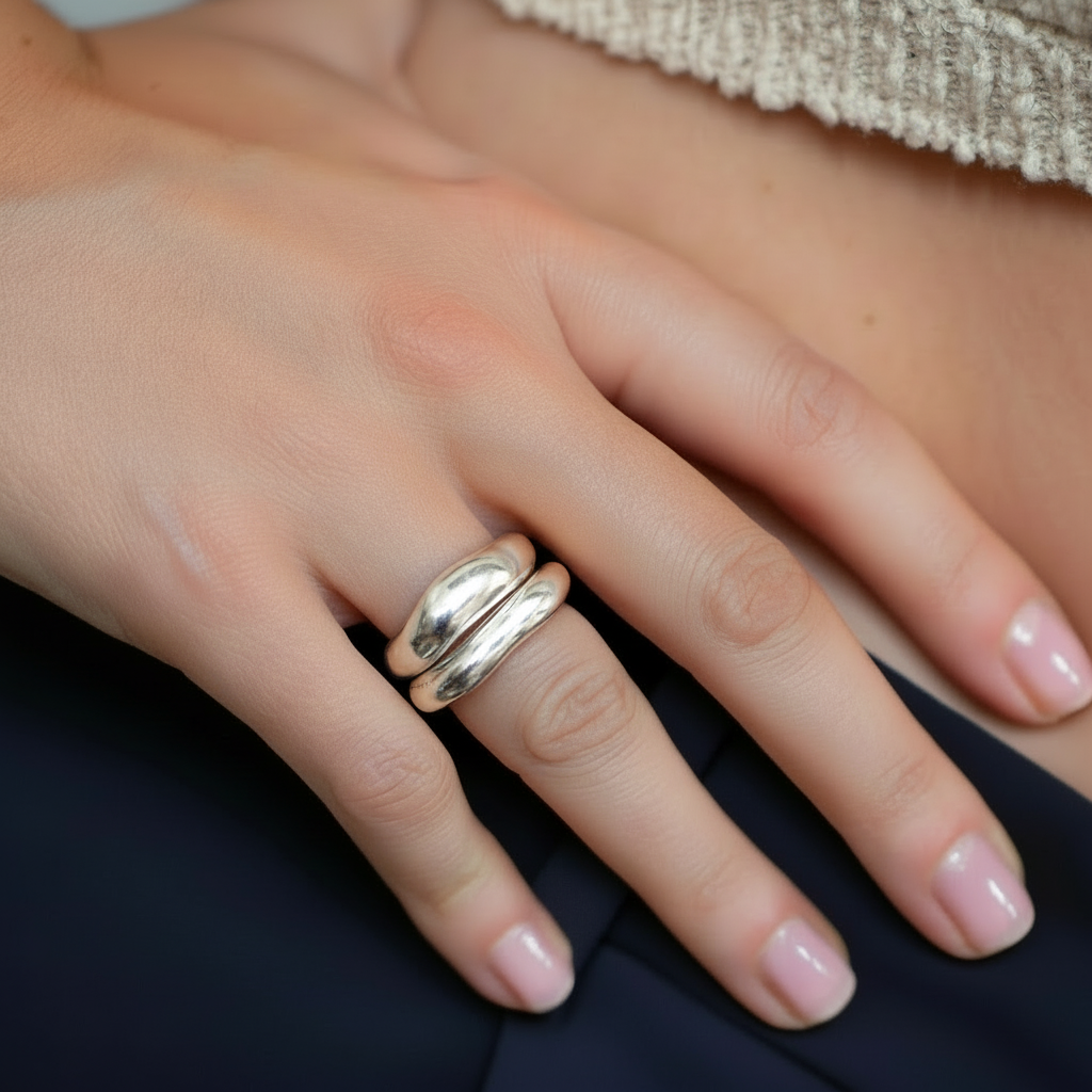 Hand wearing  silver rings on a model
