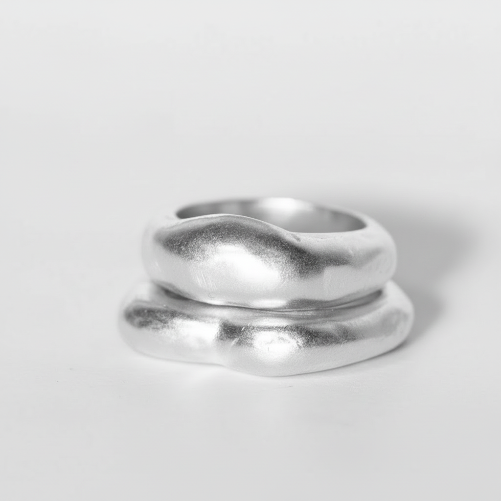Silver rings on a light gray background