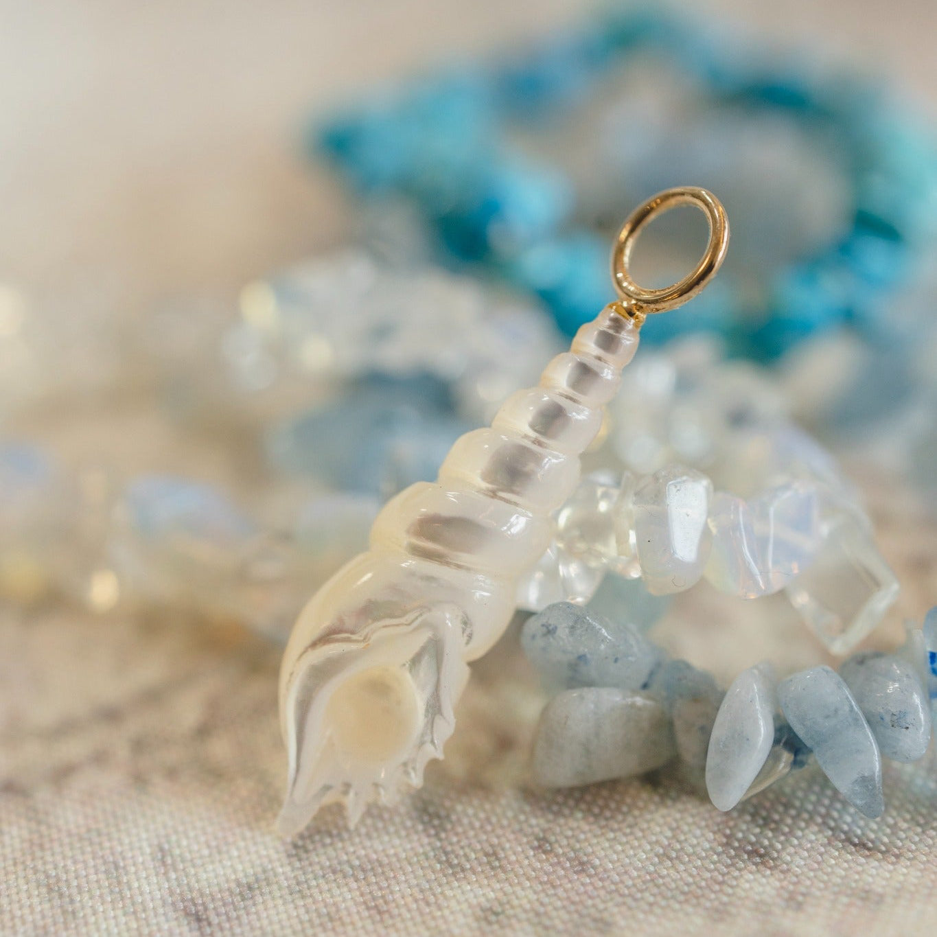 Spiral Shell Charm – Hand Carved Mother of Pearl with 14k Gold