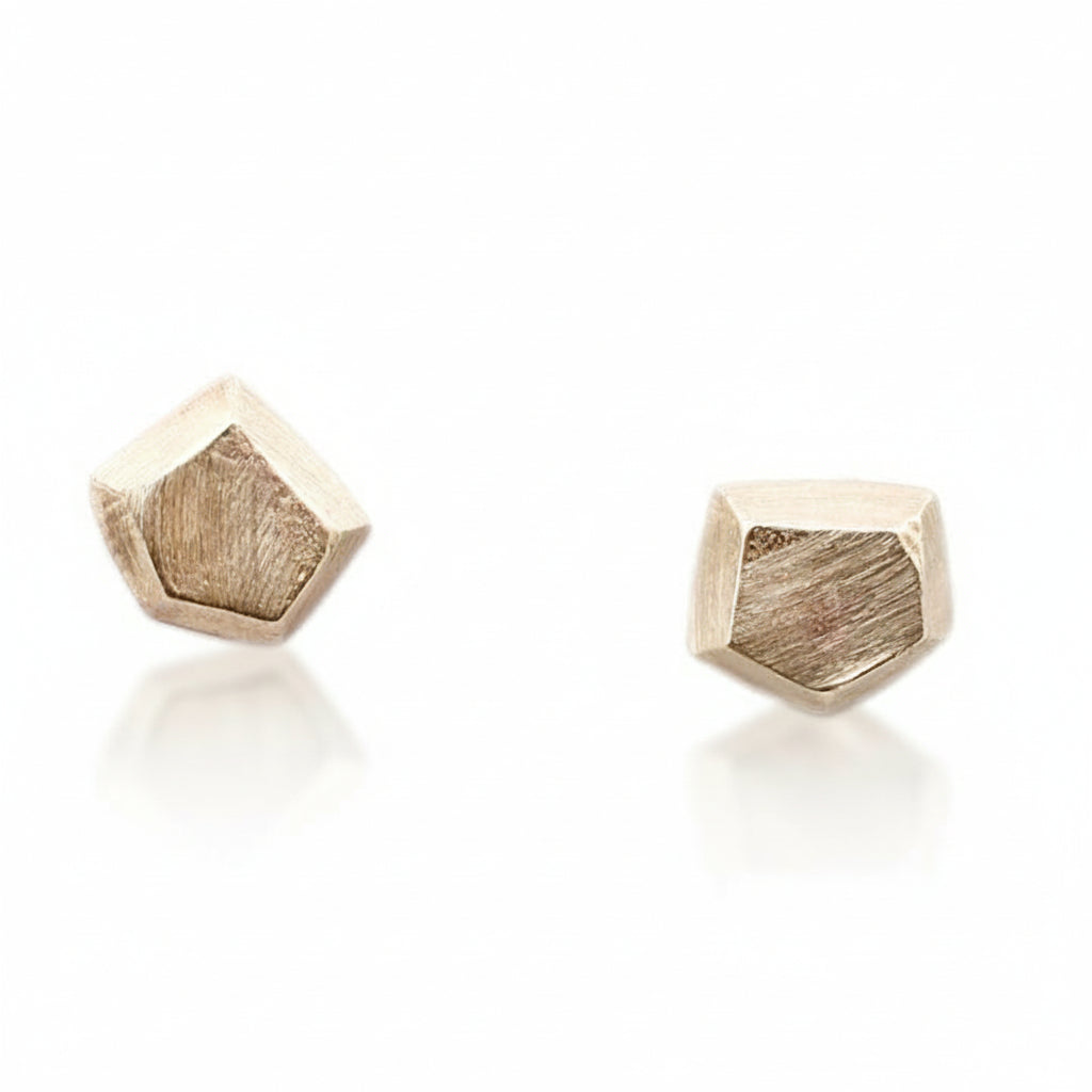 A pair of 14k yellow gold geometric stud earrings with a friction post and earring back.