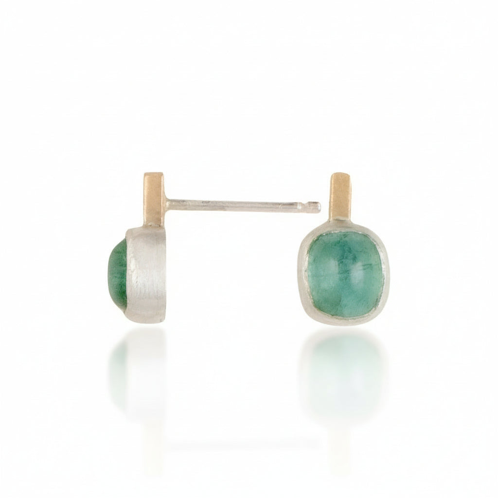 Pair of earrings with green tourmaline gemstones on a white background