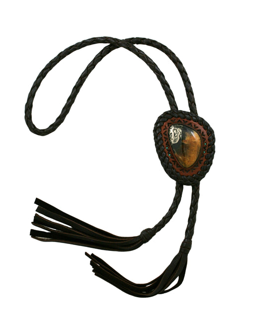 Hand-tooled leather bolo tie featuring Simbircite and Pyrite stone by Kelly Horrigan Handmade, shown on white background.
