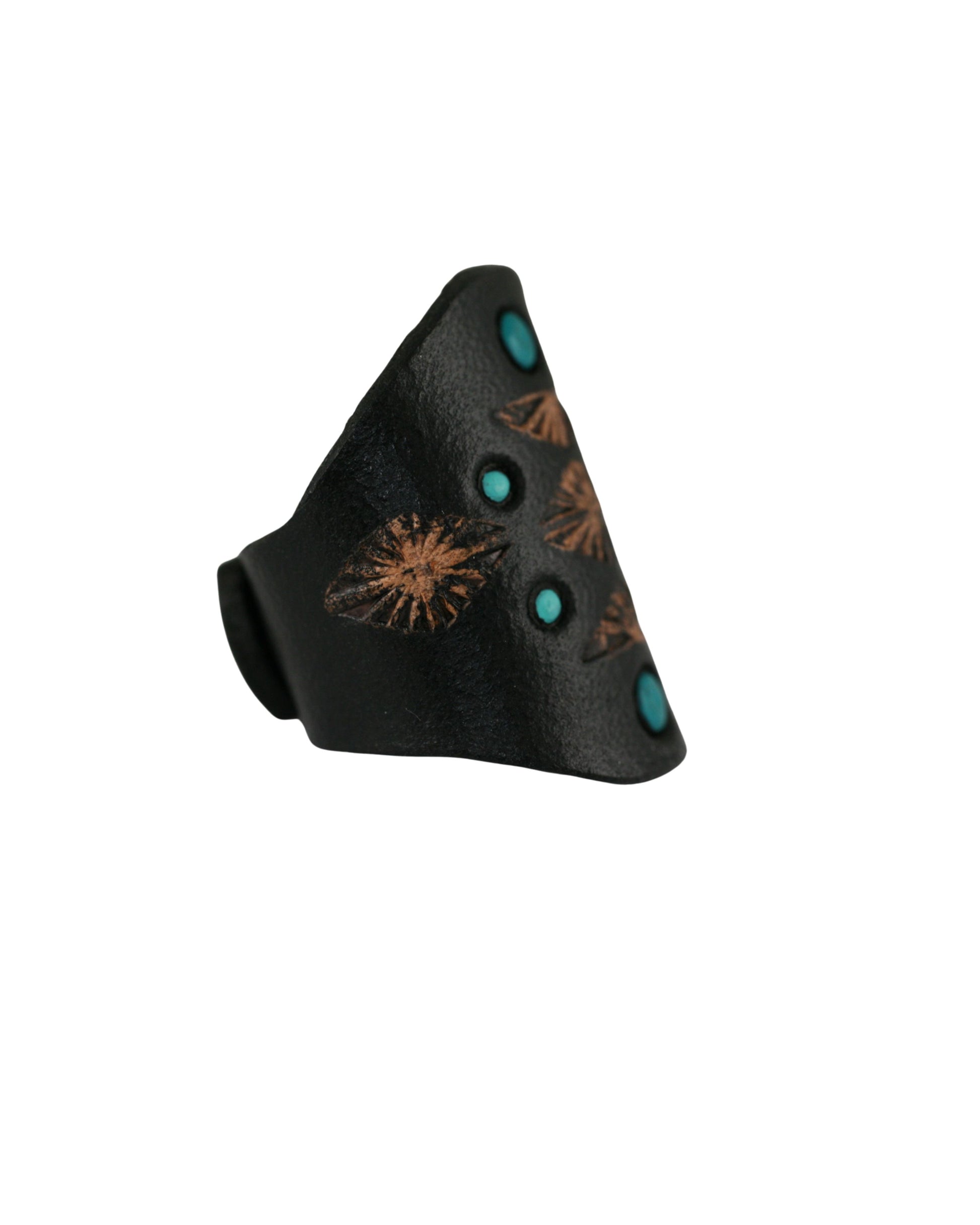 Side view of a black hand-tooled leather ring featuring turquoise accents and floral patterns.