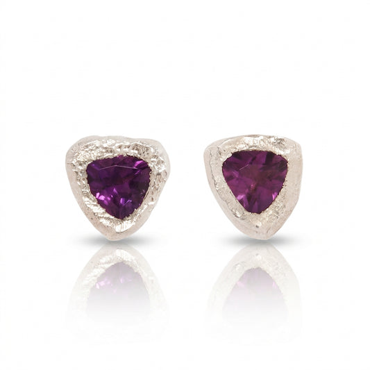Pair of Amethyst Petra Stud Earrings by Alexis Pavlantos featuring 4mm trillion-cut purple amethysts set in textured sterling silver with a soft brushed finish.