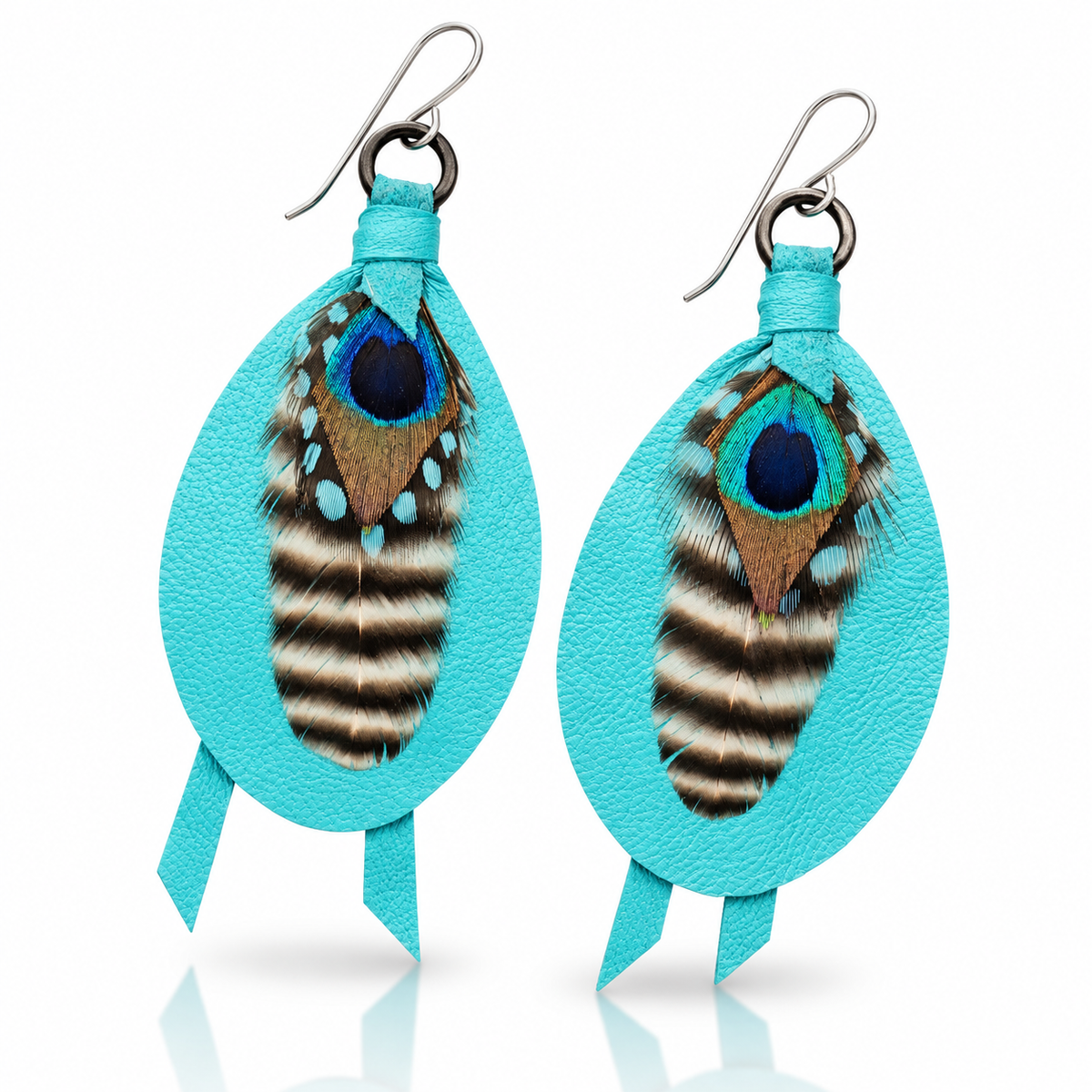 Handmade aqua leather drop earrings by Kelly Horrigan featuring natural peacock feathers, black-and-white striped feather accents, and sterling silver French hooks.