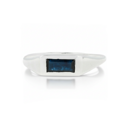 Sterling silver Baguette Signet Ring by Adeline Jewelry featuring a horizontal deep blue baguette-cut sapphire in a sleek geometric setting on white.