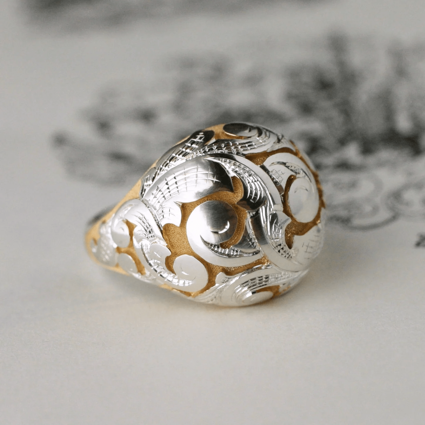 Acanthus Bombe Ring in sterling silver with gold tones by Blue Blue Driver, front angled view.