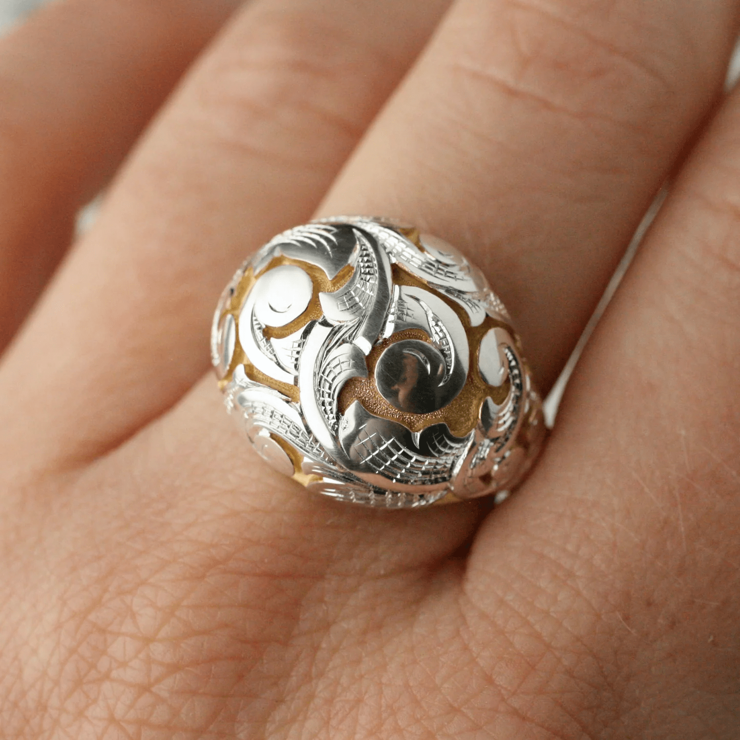 Sterling silver Acanthus Bombe Ring with gold accents by Blue Blue Driver shown on hand.