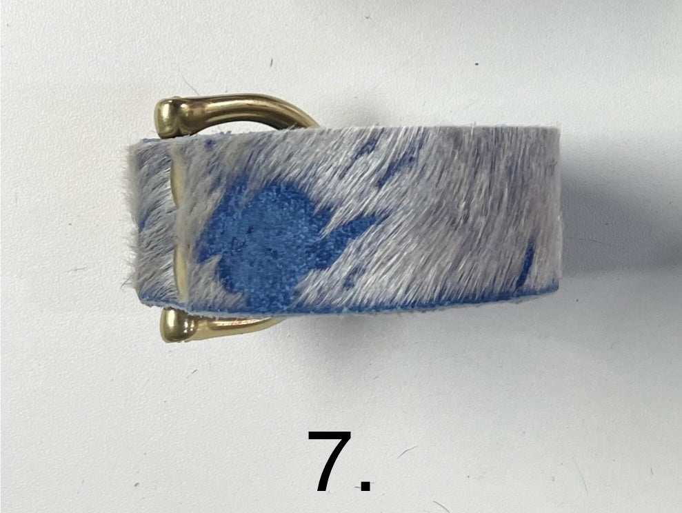 Blue and white cowhide leather cuff bracelet with brass snap closure.