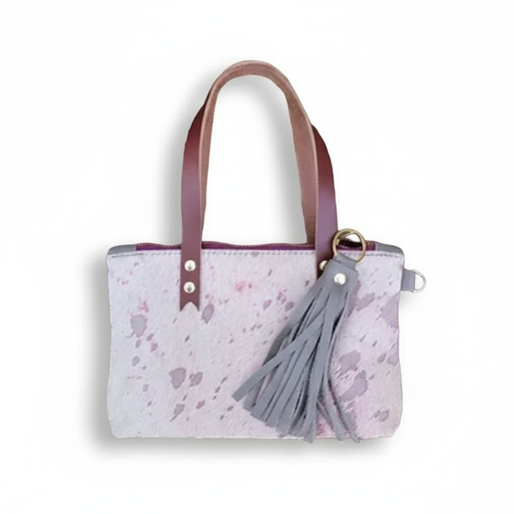 Stout Clutch Bag by BuxieJo made from hand-selected leather with pink handles and a gray tassel.