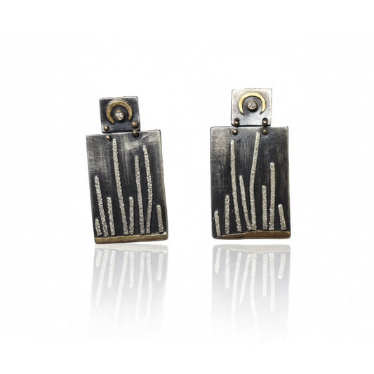 Mixed metal cactus dangle earrings by Erin Cuff featuring textured sterling silver, 18k yellow gold accents, and reclaimed white diamonds.