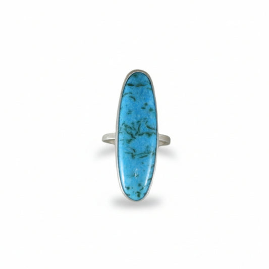 Campitos Turquoise Ring by Ana Eugenia, featuring a long, bright blue turquoise cabochon with natural dark matrix in a brushed sterling silver setting.