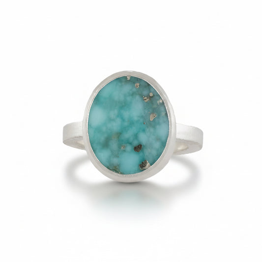 Campitos Turquoise Oval Ring by Ana Eugenia, featuring a natural blue turquoise cabochon with distinctive matrix patterns in a brushed sterling silver setting.