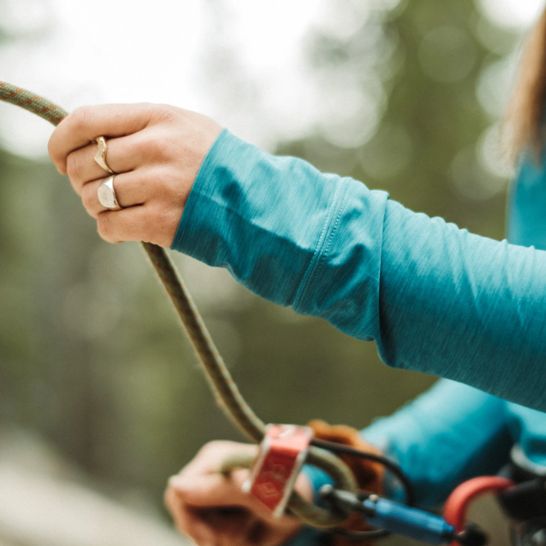 Compass signet ring worn outdoors