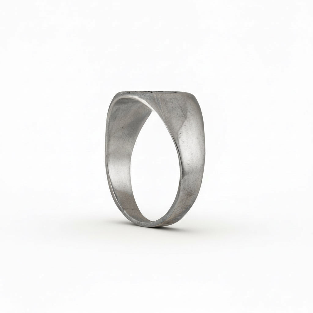 Side view of the sterling silver compass ring showing the smooth band profile.