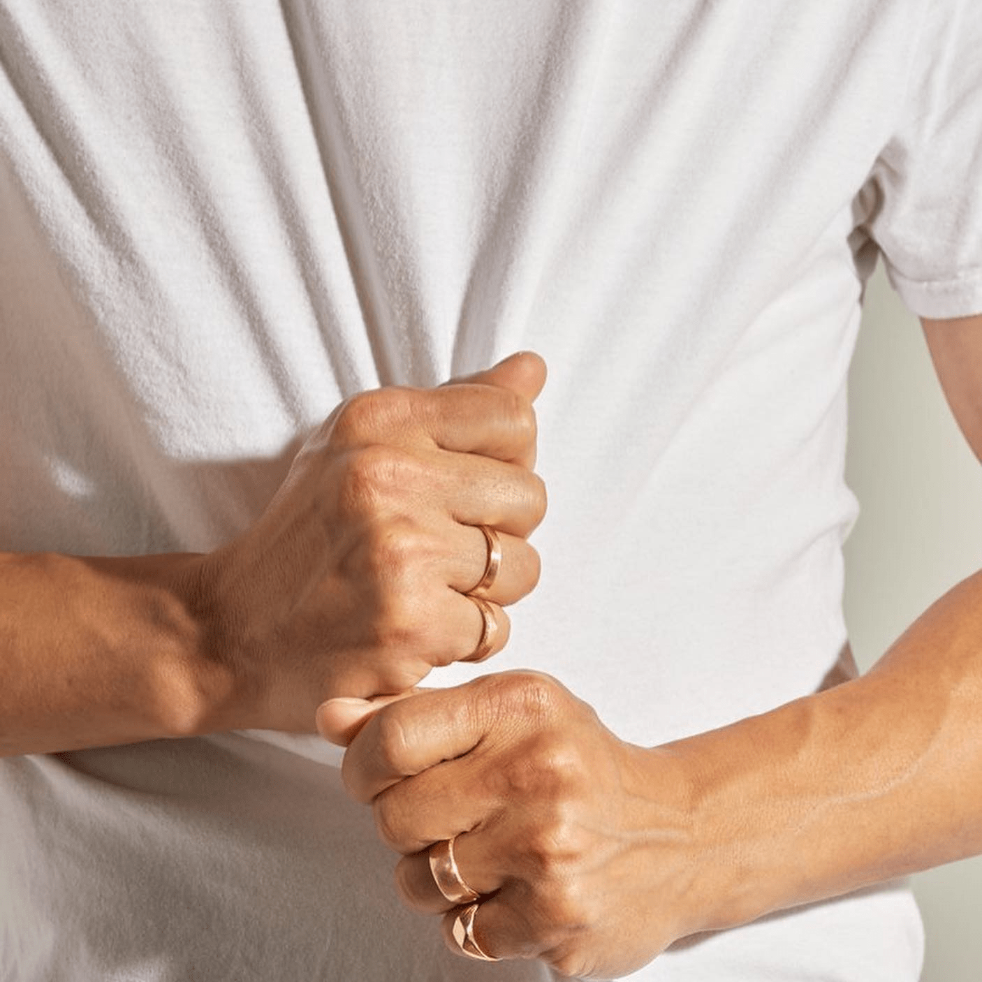 Crag Ring in 14k yellow gold worn on hand, photographed in a natural pose