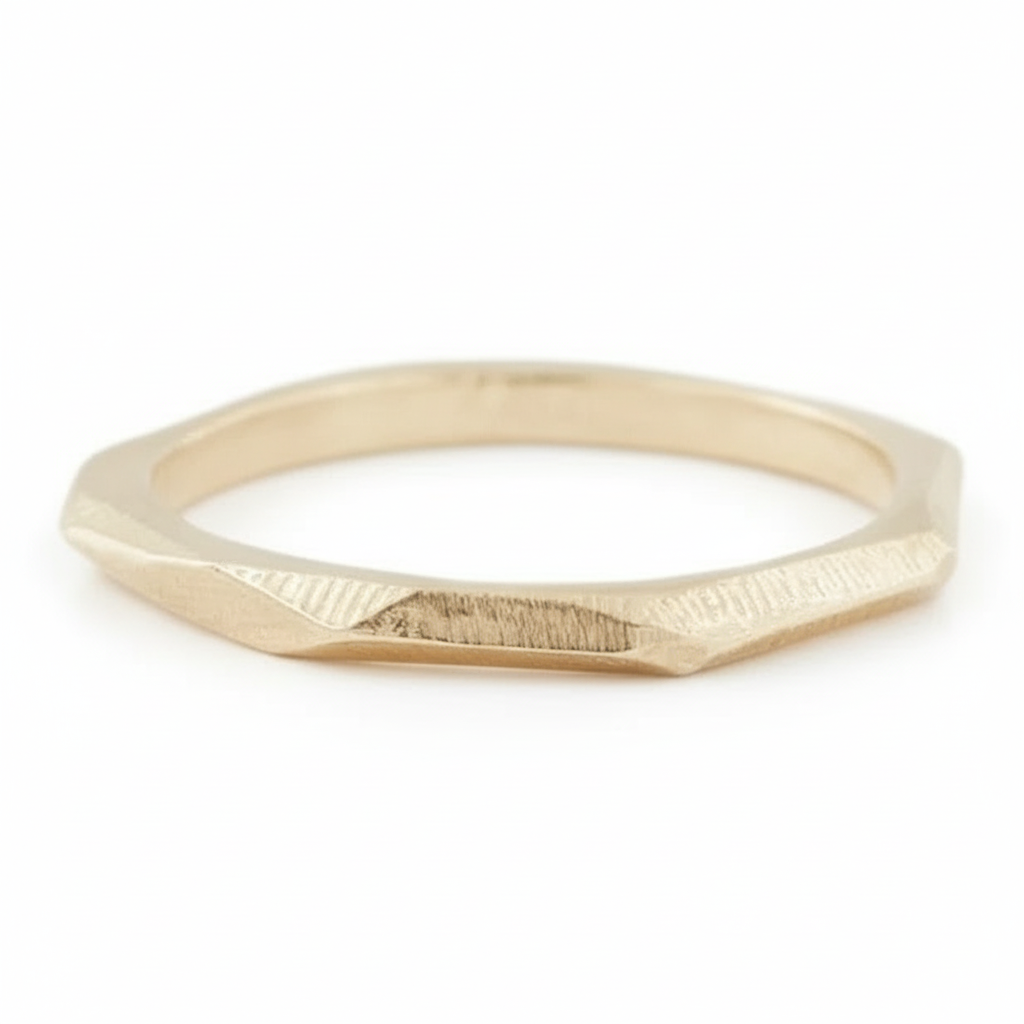 Crag Ring in 14k yellow gold, showcasing its faceted raw-surface design.