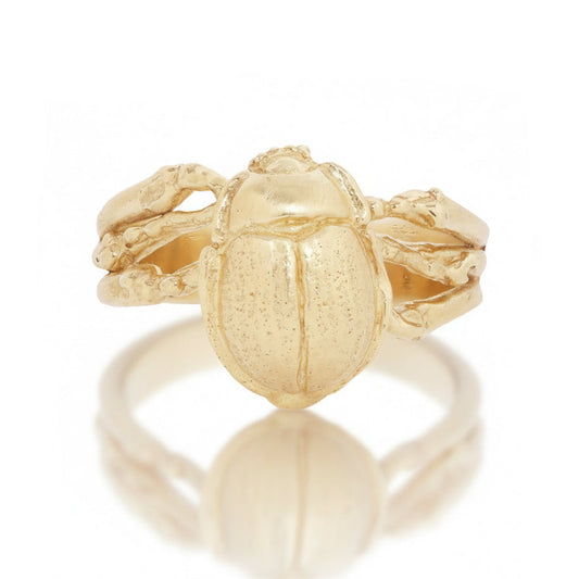 Hand-carved 14k yellow gold Desert Beetle Ring by Alexis Pavlantos, featuring a detailed three-dimensional beetle with textured wings and an organic sculptural band.