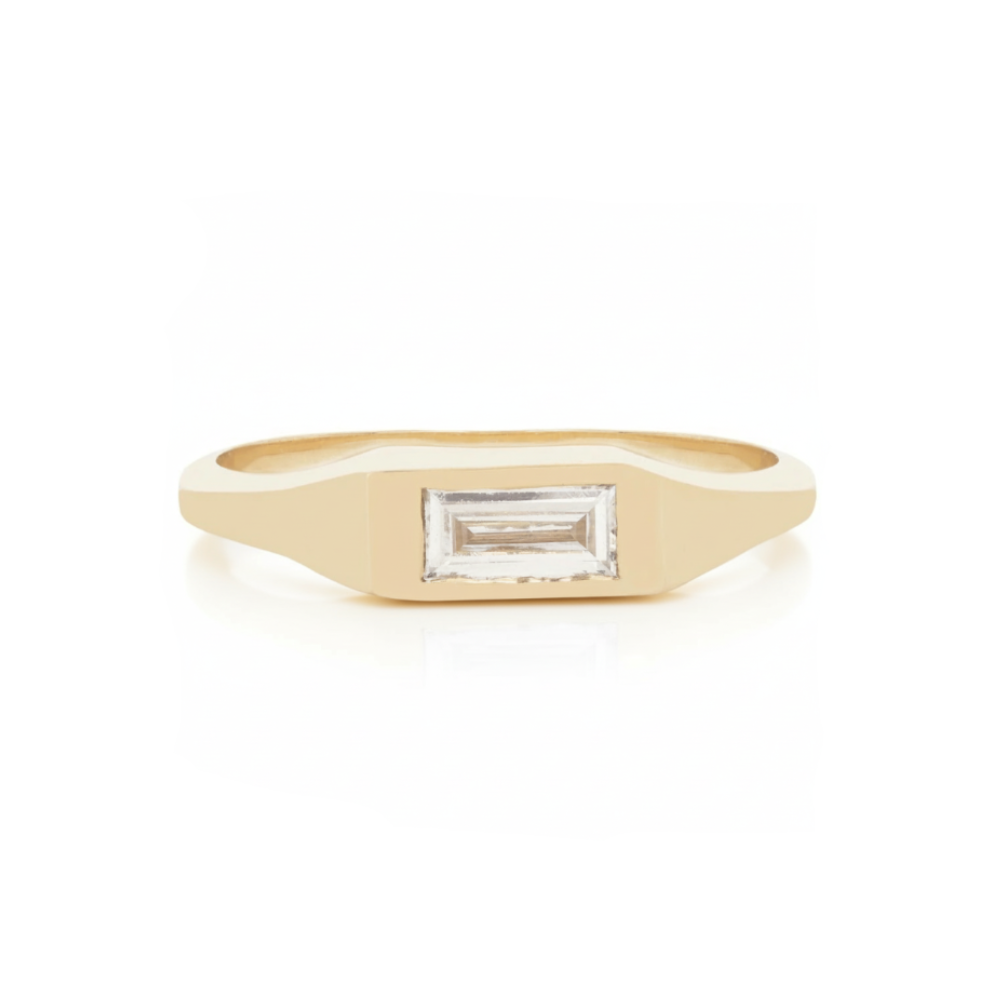 Front view of 14k yellow gold signet ring with rectangular white diamond baguette.