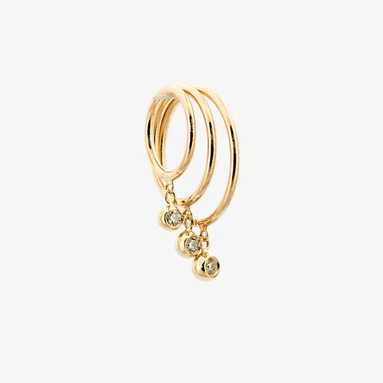 Three 14k gold diamond droplet huggie earrings displayed together on a white background.