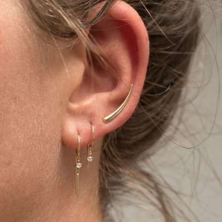 Model wearing the 14k gold Diamond Loopdie Earring – minimalist drop stud on ear.