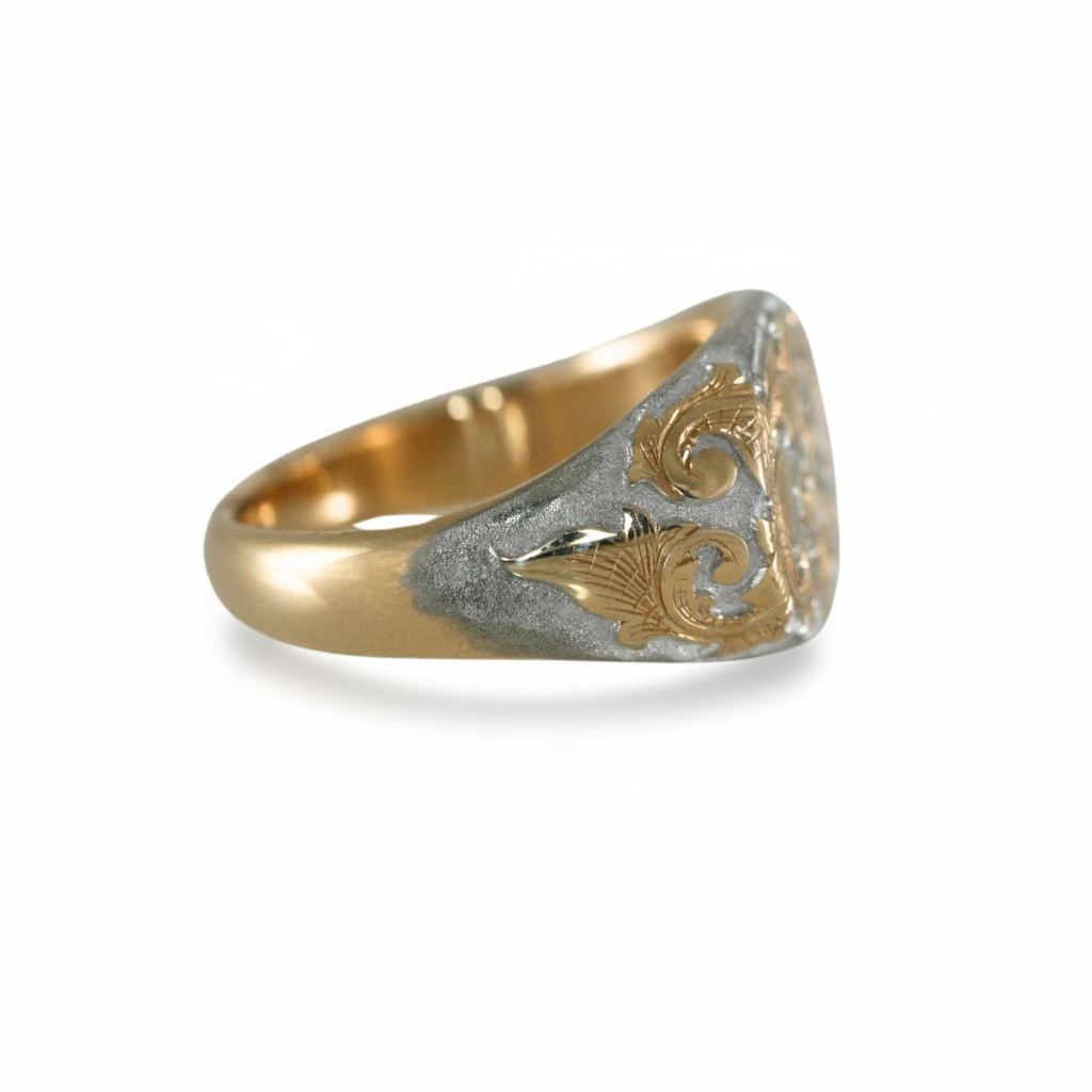 Side view of the East-West Acanthus Signet Ring in 14k gold with rhodium background and hand-engraved scroll details