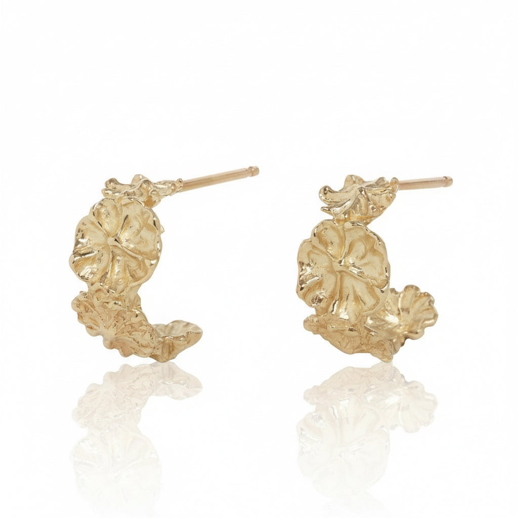 Pair of handcrafted Efflorescent Hoop Earrings in 14k yellow gold by Alexis Pavlantos, featuring sculptural floral petals and textured botanical details.