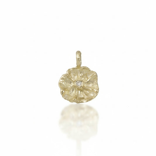 Hand-sculpted Efflorescent Flower Charm in solid 14k yellow gold by Alexis Pavlantos, featuring textured organic petals and a 1.5mm natural brilliant-cut diamond at its center.