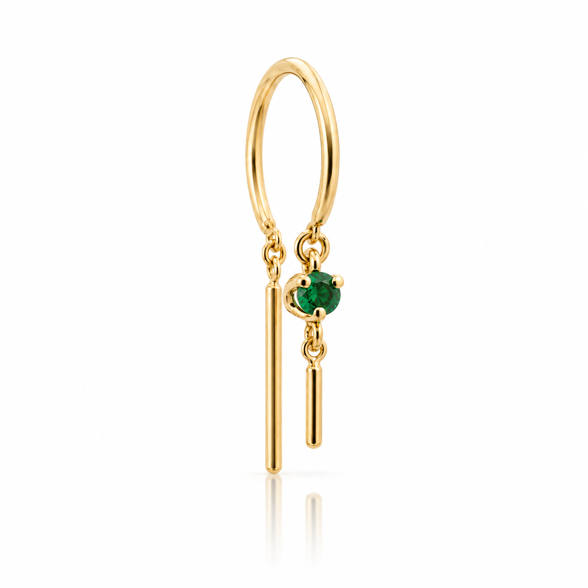 Front view of a single 14k yellow gold hoop earring featuring a prong-set green emerald and two articulated gold drops.