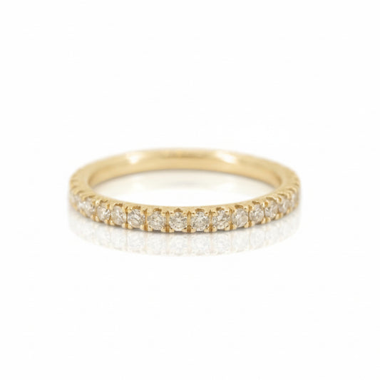 14k yellow gold eternity band by Erin Cuff featuring 0.16 carats of recycled white pavé-set diamonds in a delicate stacking ring design.