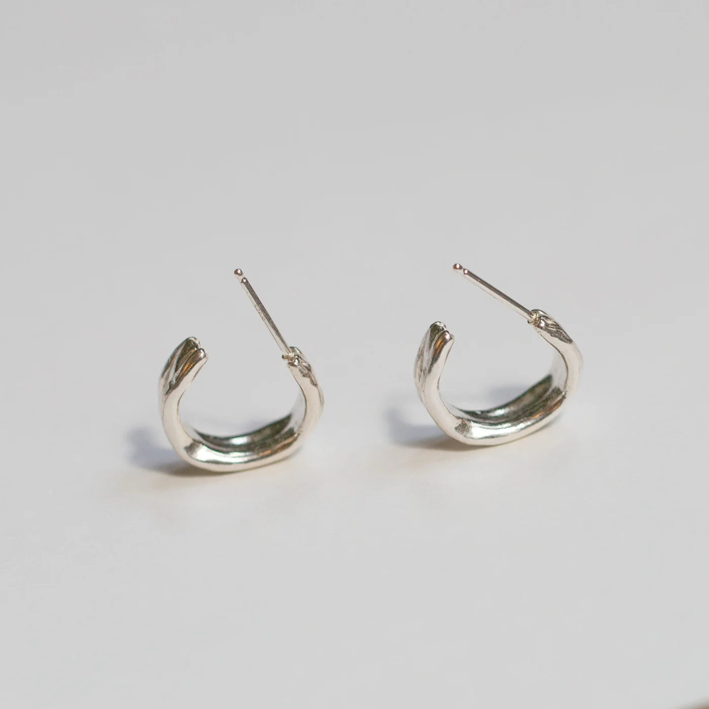 Sterling silver Fluvial Hoops shown from the stud back angle