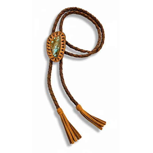 Handmade Galaxy turquoise bolo tie by Kelly Horrigan featuring a natural #8 turquoise stone, warm tan hand-tooled leather setting, brown braided cord, and leather tassels.
