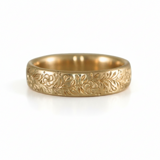 Globemallow Band by June Cream in solid 14k yellow gold, featuring intricate hand-engraved desert wildflowers and botanical detailing.