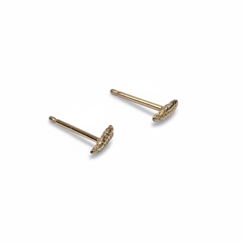 Back view of solid 14k yellow gold wheat stud earrings showing their slim posts and petite sculptural design.