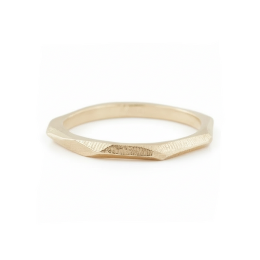 14k yellow gold Crag Ring by Adeline Jewelry featuring a slim geometric band with irregular faceted edges and subtle textured surfaces on white.