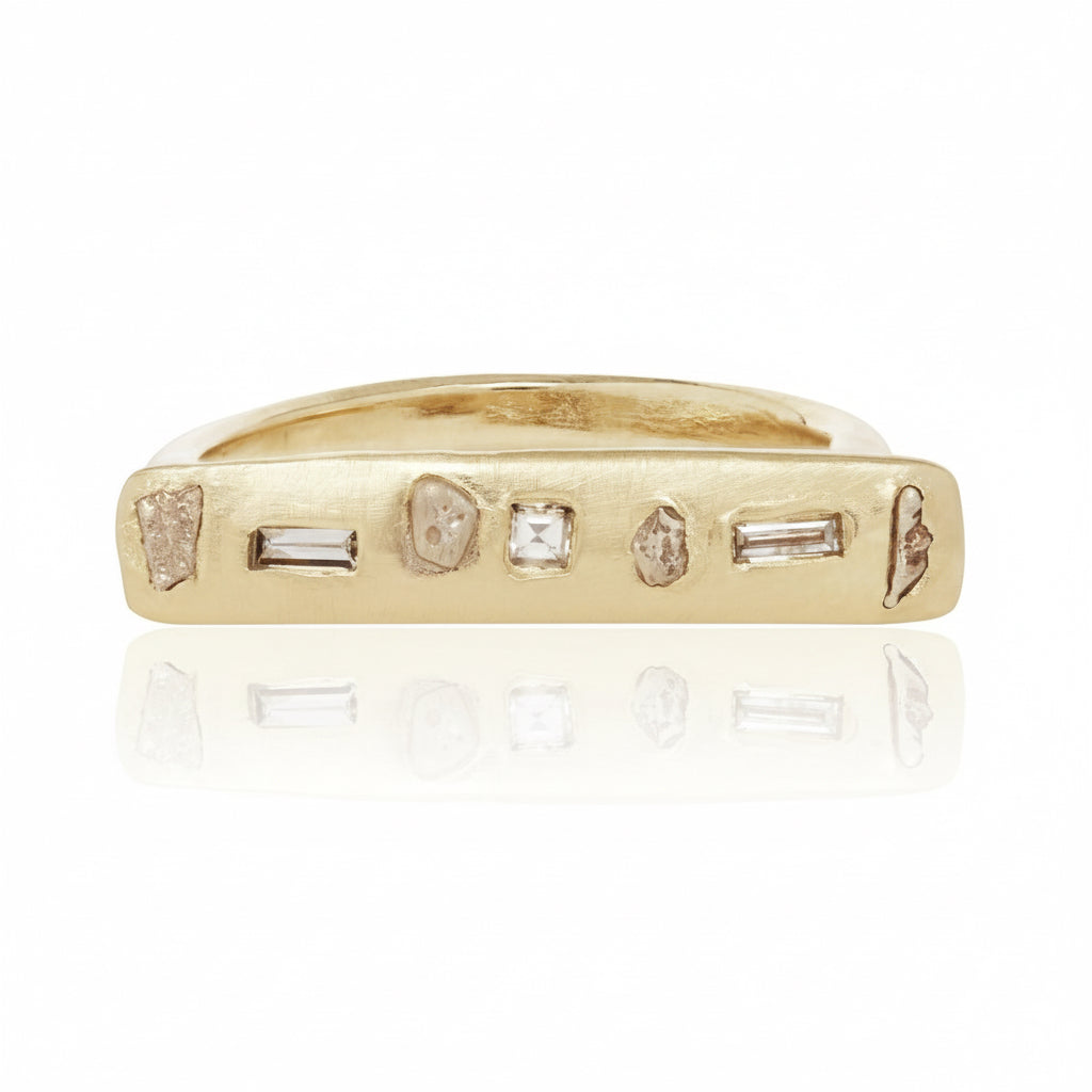 Handcrafted Gonia Ring by Alexis Pavlantos, featuring a slim 14k yellow gold bar set with 0.20 carats of repurposed diamonds in assorted cuts and sizes.