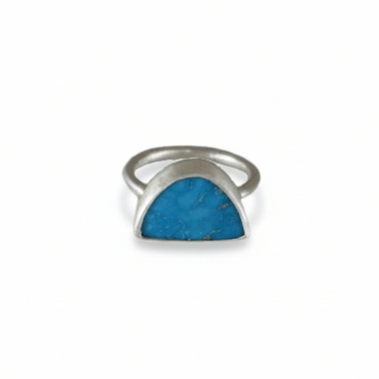 Half Circle Turquoise Ring by Ana Eugenia, featuring a vivid blue semicircular turquoise gemstone set in brushed sterling silver with a minimalist double-band design.
