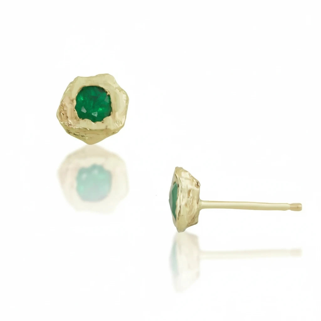 Front and side views of handcrafted 14k yellow gold Emerald Petra Stud Earrings, highlighting the natural green emeralds, sculptural gold settings, and straight earring posts.