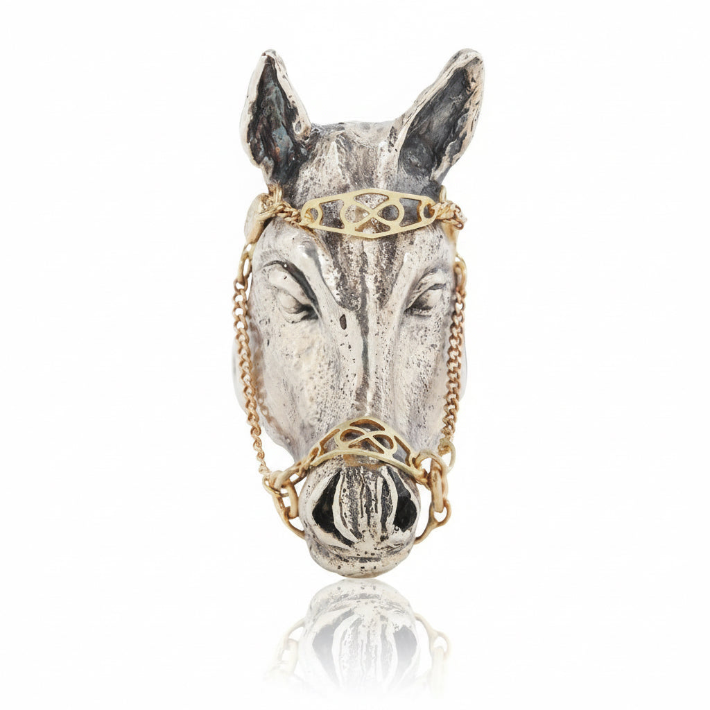 Front view of the sterling silver Horse Ring by Alexis Pavlantos, highlighting the lifelike horse head, upright ears, and intricate movable 14k yellow gold bridle.