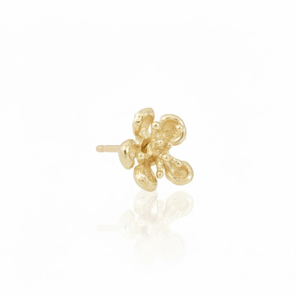 Single 14k yellow gold Kinetic Flower Stud Earring showing hand-carved petals, textured gold finish, and delicate three-dimensional floral design.