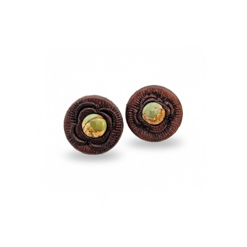 Handcrafted Kingman turquoise stud earrings by Kelly Horrigan Handmade, featuring natural turquoise stones set in hand-tooled brown leather with sterling silver posts.